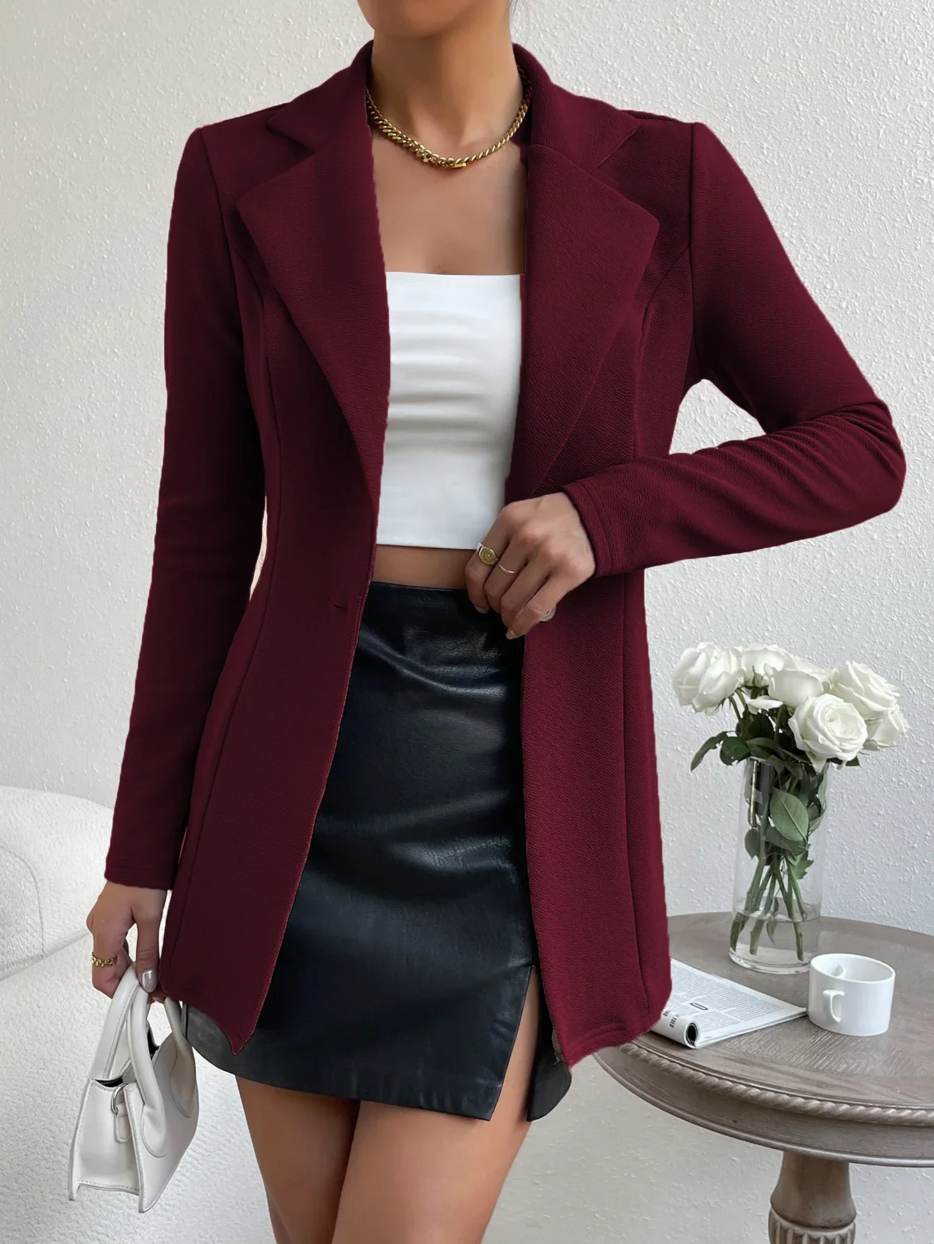 Cappotto lungo da donna per il tempo libero in tessuto di stoffa a maniche lunghe con temperamento in tinta unita autunnale e invernale.