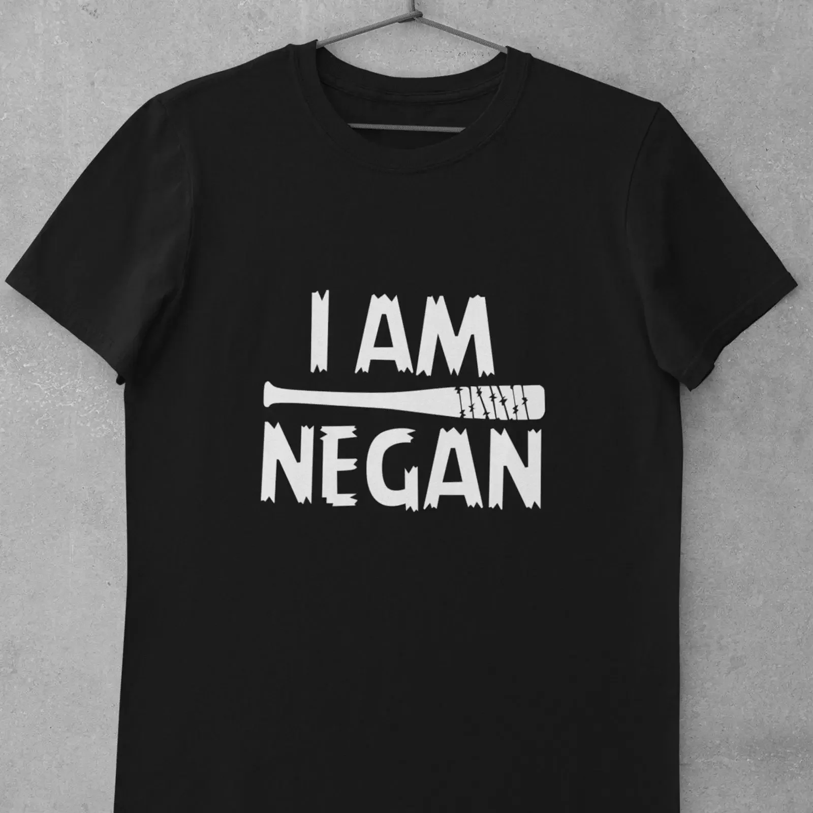 May include Black t shirt with white text that reads I AM NEGAN a barbed wire baseball bat graphic vintage Washed streetwear