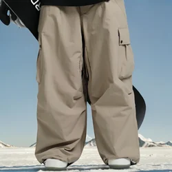 Nuevos pantalones de esquí al aire libre, pantalones de esquí cálidos, ropa de nieve para mujer, ropa de Snowboard holgada, pantalones Cargo de invierno impermeables a prueba de viento para hombre