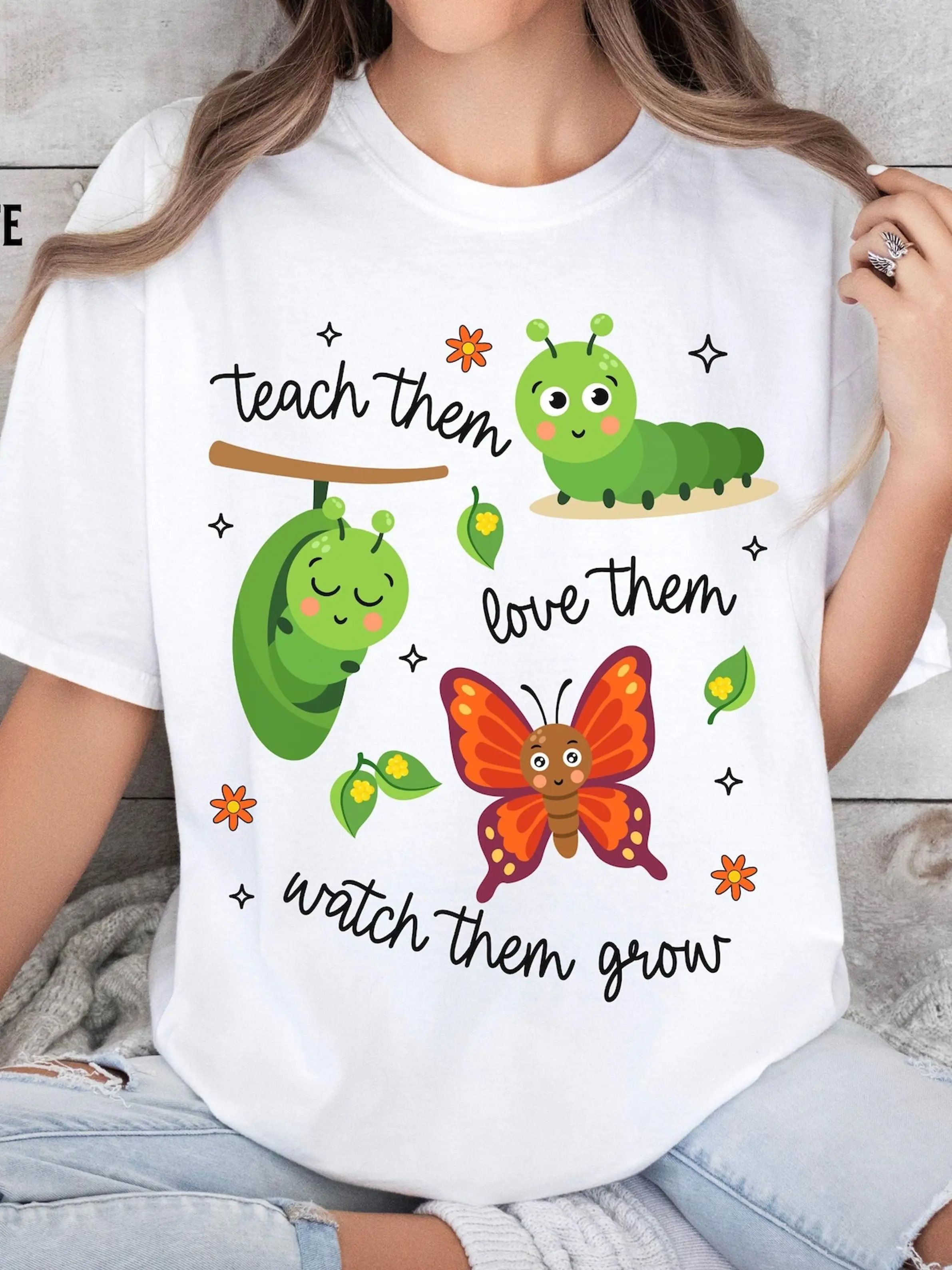 Plus Size - Plus Size - White T-Shirt with Colorful Print, Featuring Caterpillars, Butterflies, And Teach Them, Love Them, Watch Them Grow. Design Includes Green, Orange, And Brown Elements. -1 Letter Pattern, Plus Size Trendy Short Sleeve Tee