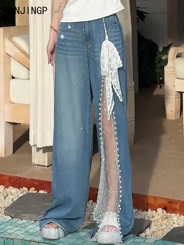 Mantianxing hot diamond mesh stitching heavy industry beaded jeans women's 2025 summer new drape wide-leg pants tide