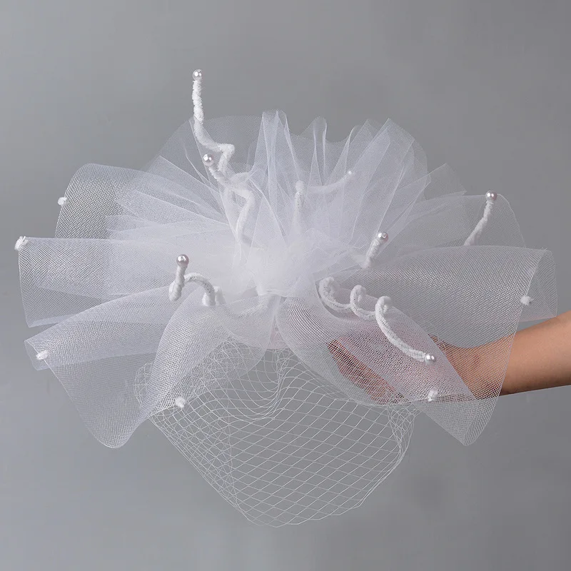 White oversized creative unique mesh headpiece for wedding fashion shows performances and photoshoots a stylish head covering