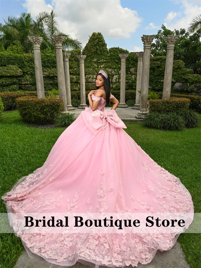 หรูหราสีชมพู Quinceanera เดรสโบว์ดอกไม้ผีเสื้อ Appliques คริสตัลหวาน 16 Ball Gown ที่กําหนดเอง