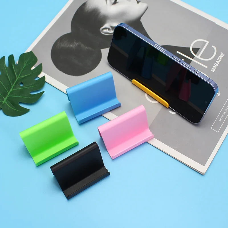 Soporte de escritorio de plástico para teléfono móvil, Mini soporte portátil Universal para teléfono inteligente, Color caramelo