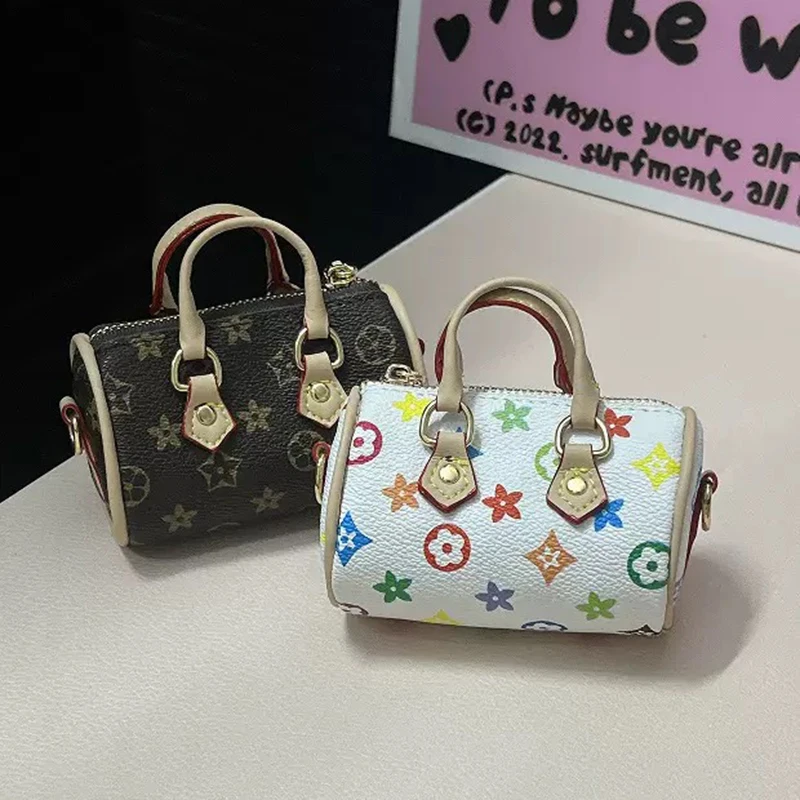 Mini funda para auriculares con almohada texturizada, monedero que puede contener auriculares, cambio suelto, lápiz labial y otros artículos pequeños con una correa