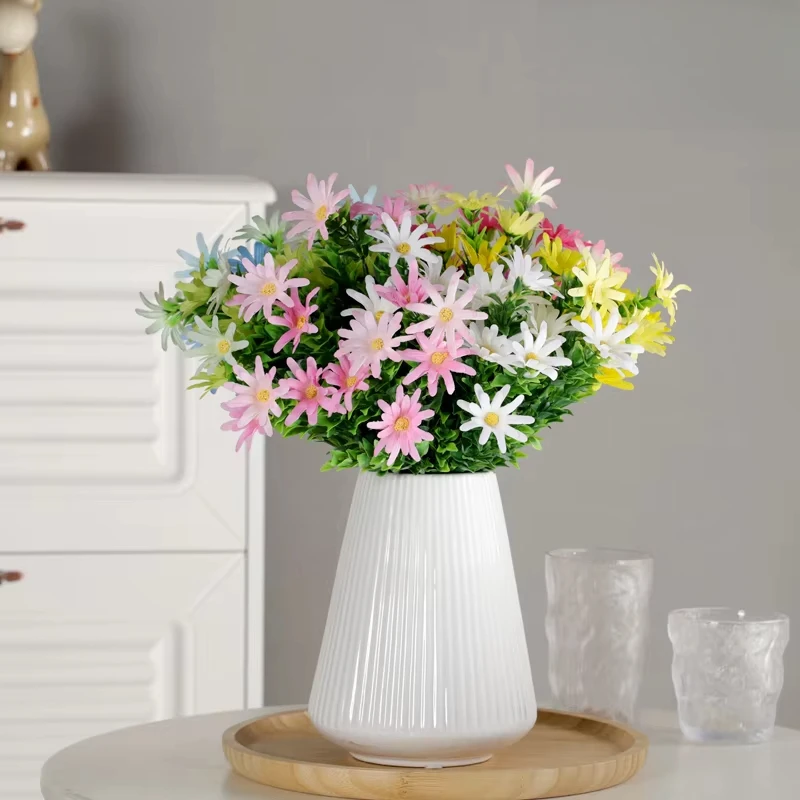 

A small bunch of artificial flowers fake bouquets plastic flowers living room furnishings floral arrangements