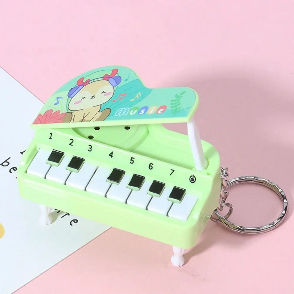 Cor sólida mini piano eletrônico chaveiro urso vertical mini piano chave pingente adorável instrumento musical audível piano chaveiro