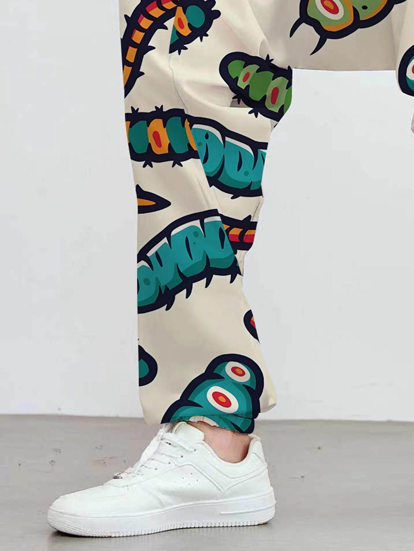 Men's ankle-length pants, featuring a cute caterpillar print, with a unique and fashionable pattern design. view 5