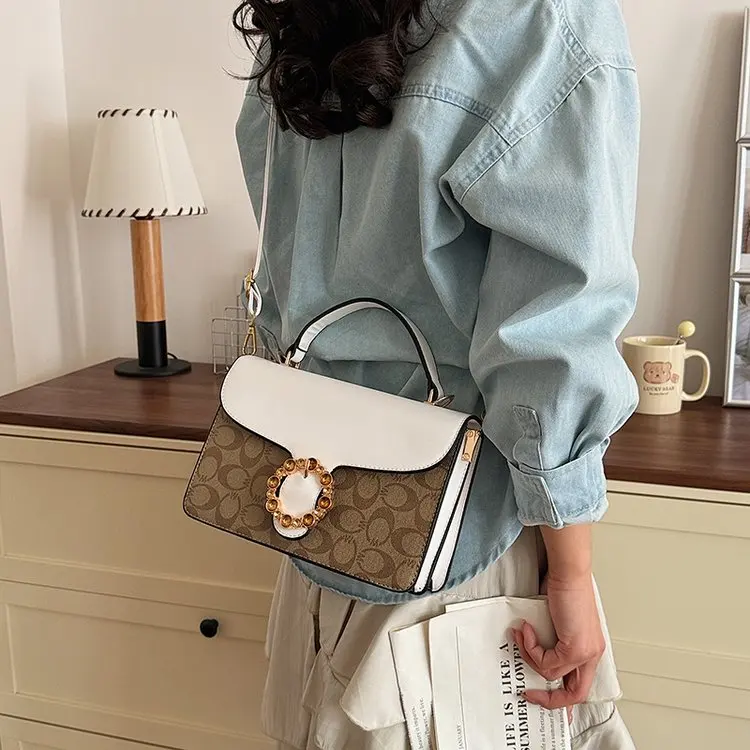 

Популярные модные элегантные кожаные сумки для подгузников для женщин, люксовый бренд, большая вместимость, минималистичная сумка через плечо, дизайнерская винтажная сумка-тоут.