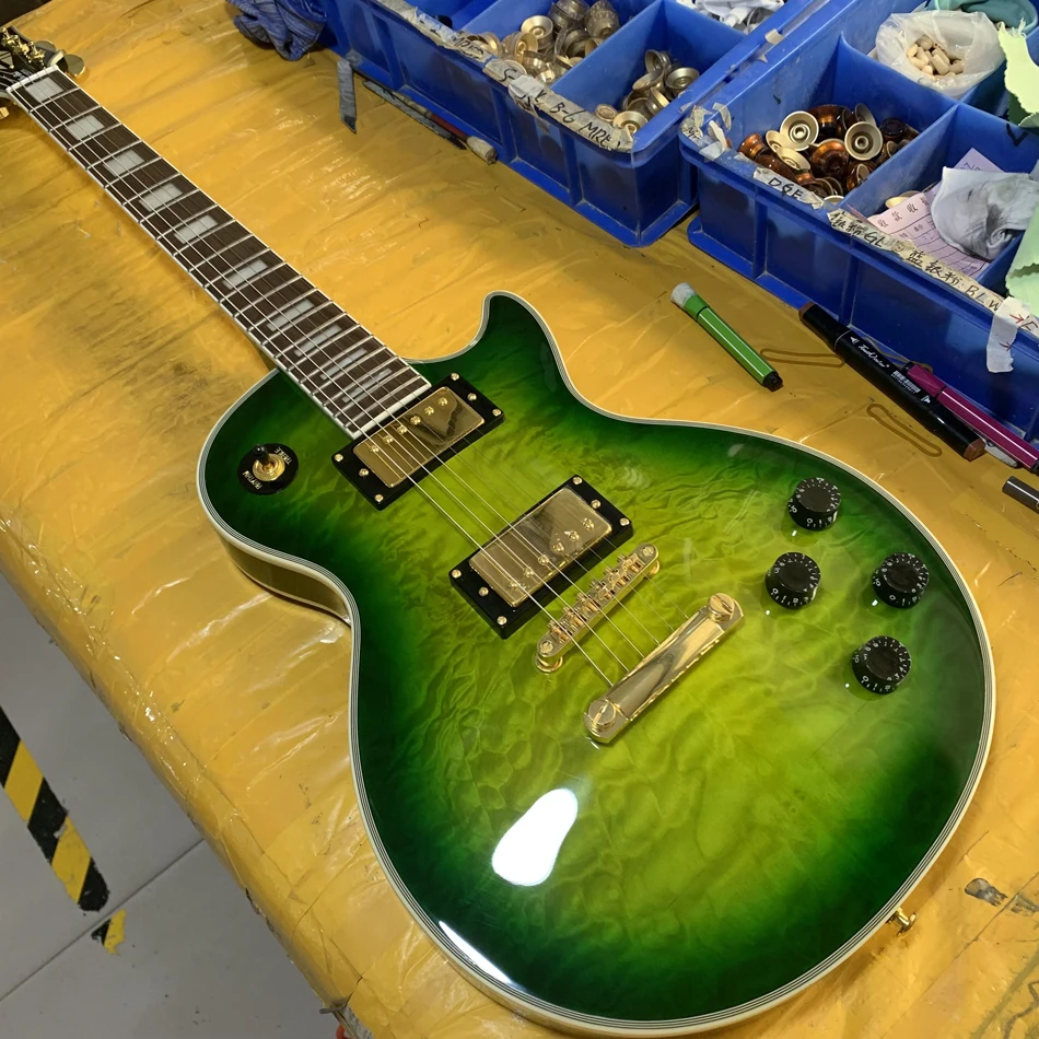 Electric guitar with green maple top, gold hardware, rosewood fingerboard