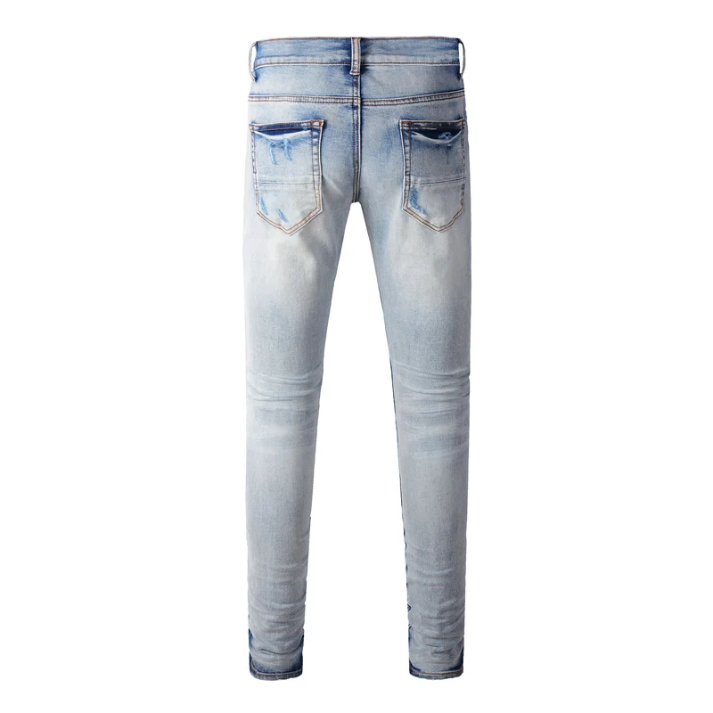 Fashionable new light blue jeans washed with nostalgia, ripped black leather patch elastic slim fit jeans, high street designer