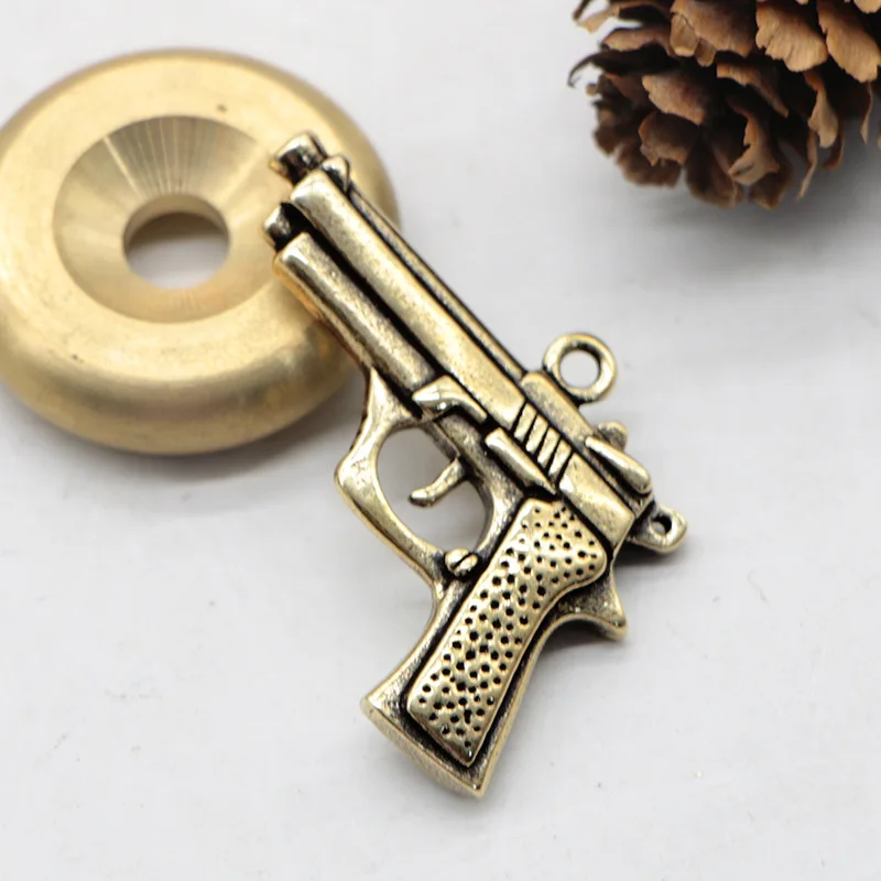 Metal brass carved three-dimensional pistol model car key chain pendant small copper pendant retro luggage accessories pendant