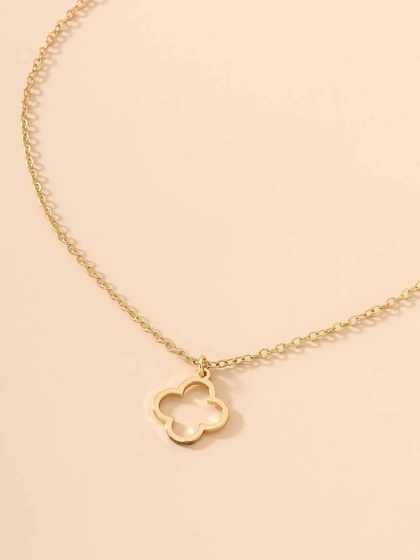 

Gold-Tone Hollow Four-Leaf Clover Pendant Necklace with Wish Legend Card