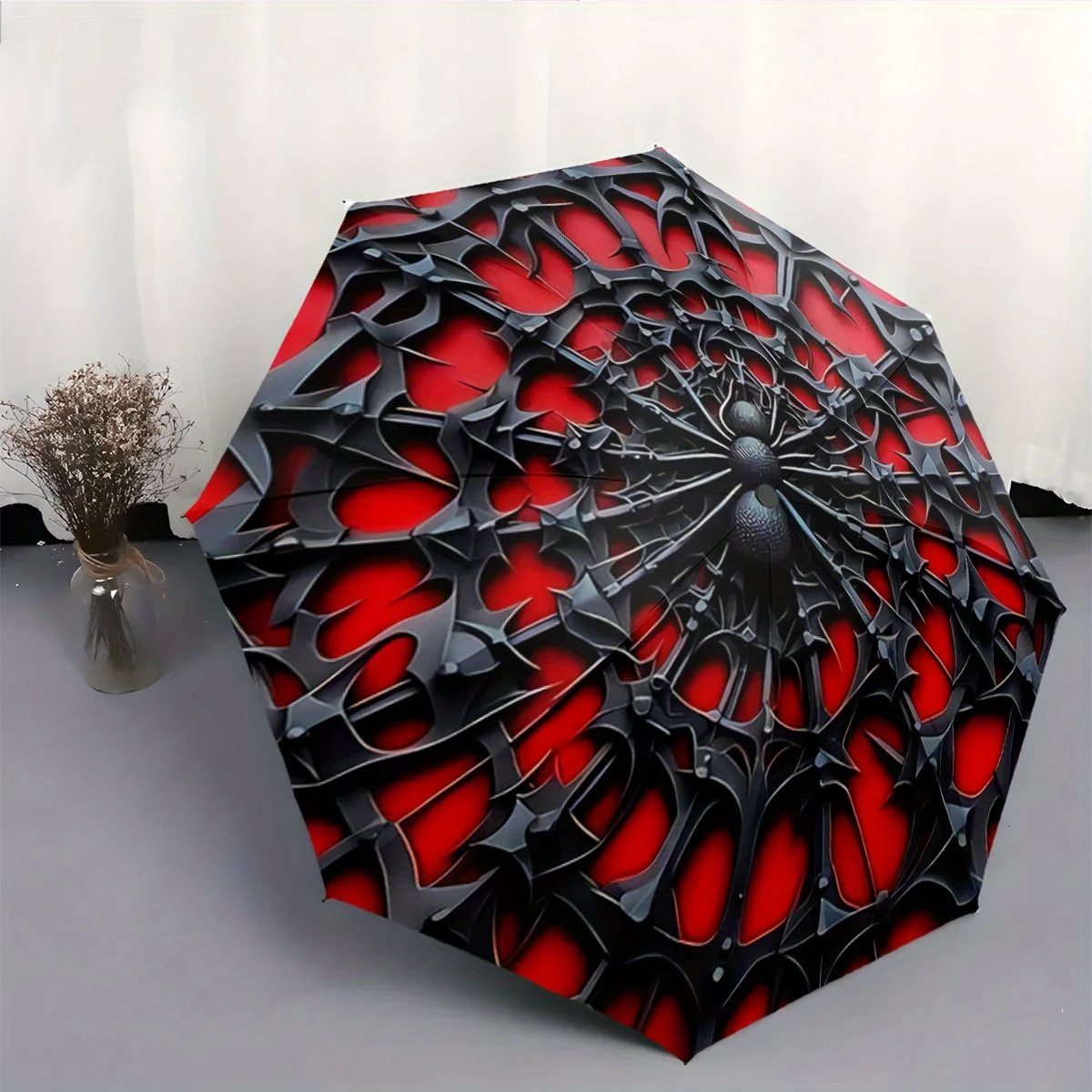 

Automatic Folding Umbrella Black Spiderweb-Like Pattern on a Red Background. Portable Collapsible Design, Casual Outdoor Acces