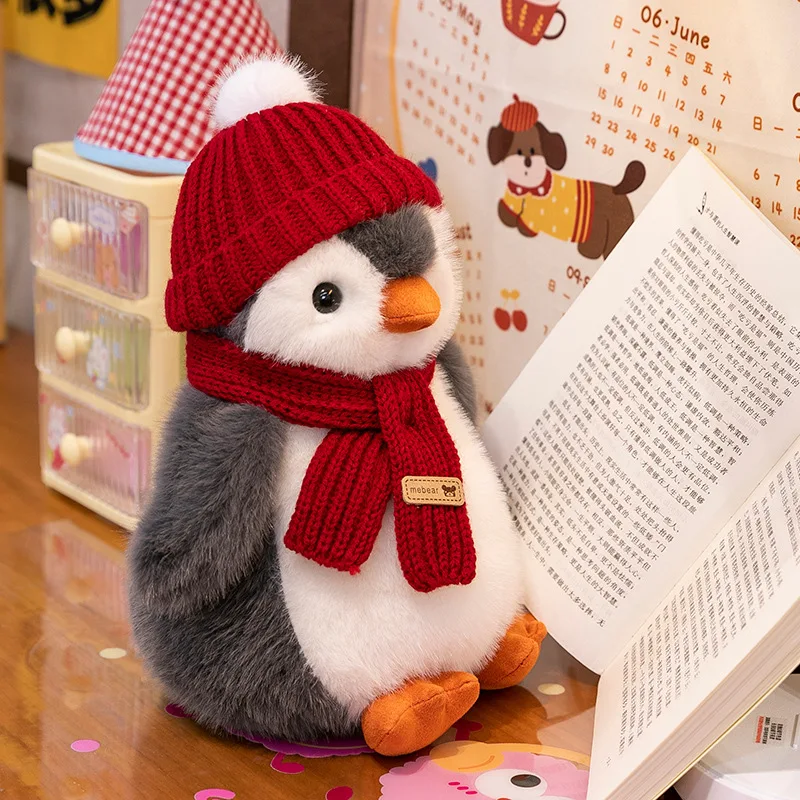 

Wearing scarf, little penguin plush toy