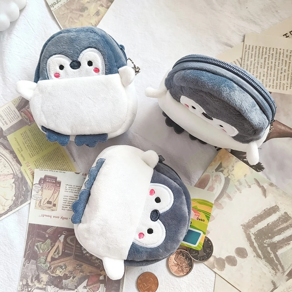 Joli petit sac de rangement en forme de pingouin, capable de stocker divers objets tels que des écouteurs, de la monnaie, des cartes bancaires, etc. Sac à monnaie.
