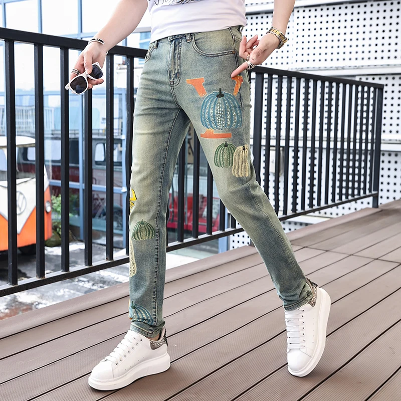 Personalized street fashion pumpkin print men's jeans 2024 spring and summer trend retro casual elastic slim tapered pants