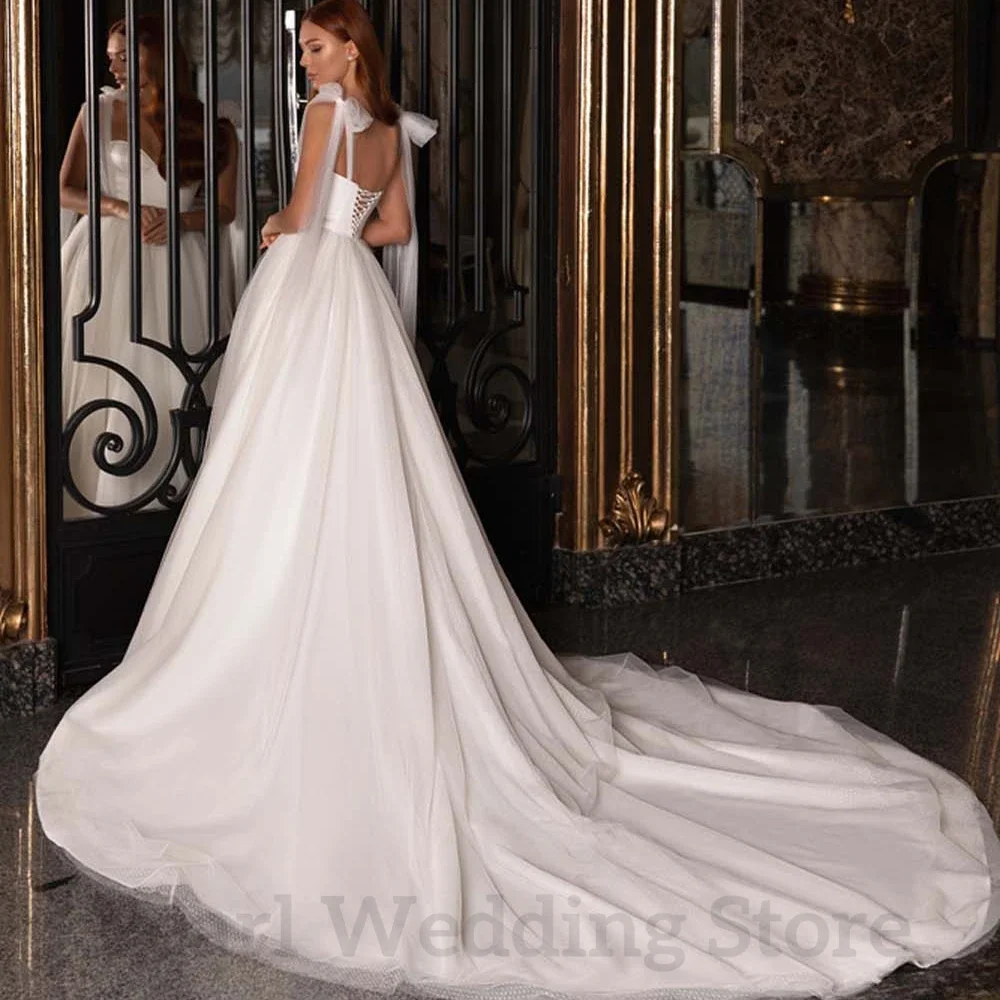 Sweetheart Tulle Spaghetti Strap Wedding Dress Bow Backless Lace-Up Bridal Marriage Gowns Court Trailing Customizable Sleeveless