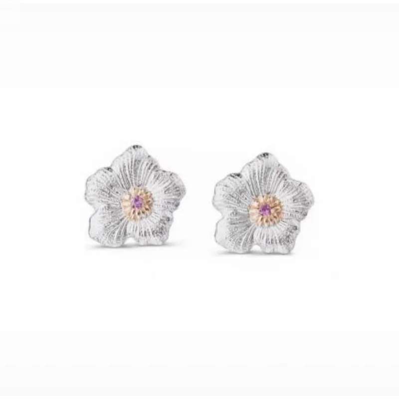

Silver Plated Two-Tone Flower Stud Earrings with Textured Finish & Purple Gem Accent