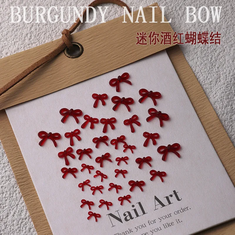 フランスワインレッドのリボンネイルアートアクセサリー、4種類のミニレジンリボンネイルチャーム、3Dバレンタインデーネイルラインストーンデコレーションパーツ