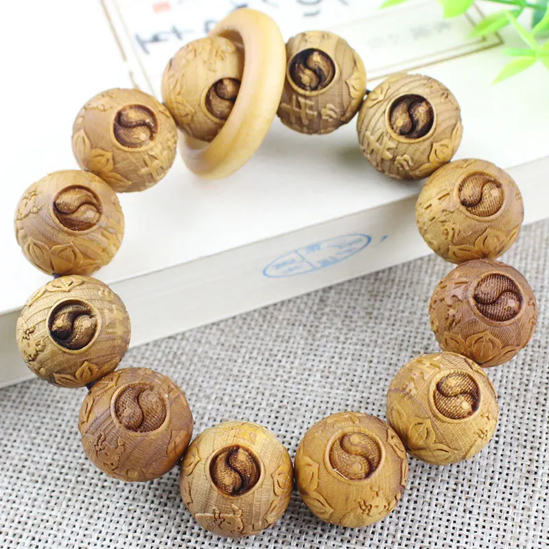 Aged Chinese cypress wood bracelet with carved Buddhist beads, a wooden cultural item for men, featuring the Eight-Trigram desig