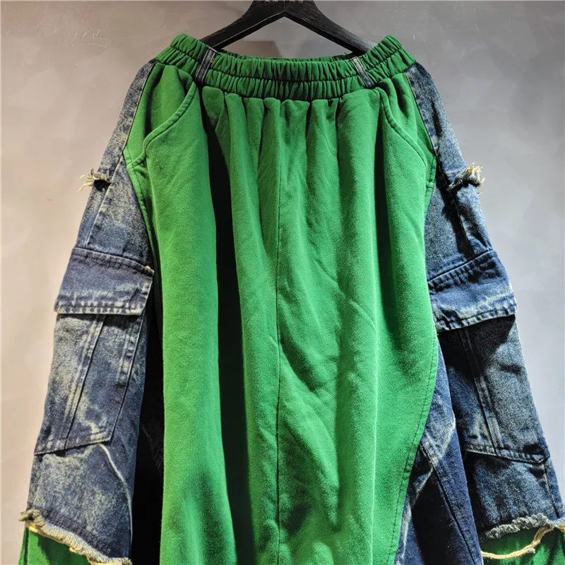 

Distressed color-block jeans. Elastic waist & drop-crotch cut. Bold street-style with adjustable comfort.