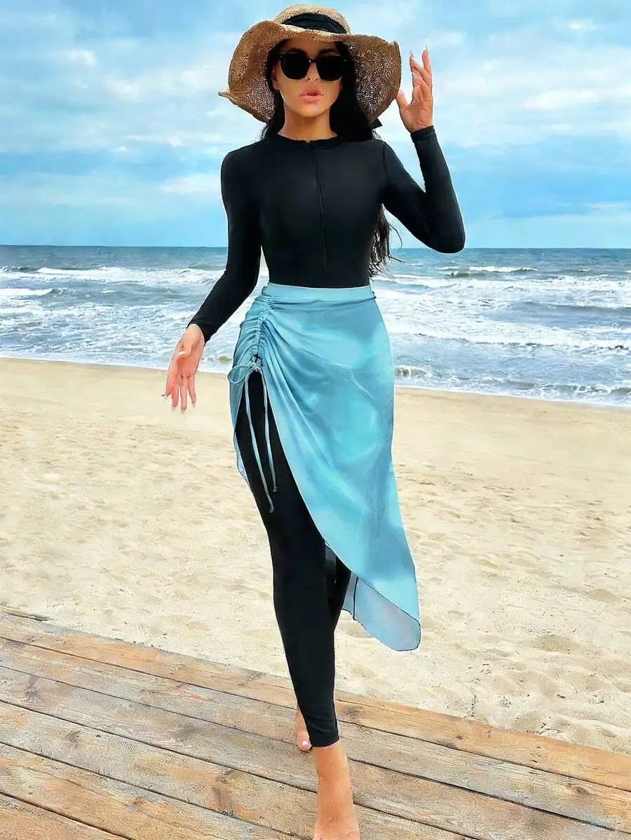 

Womens Black Long Sleeve Zip-Up Bodysuit With Light Blue Asymmetrical Wrap Skirt Beachwear Set