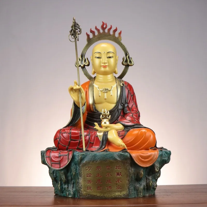 Copper-painted statue of Ksitigarbha Bodhisattva, a deity worshipped in Buddhist temples, depicted sitting with a halo behind hi