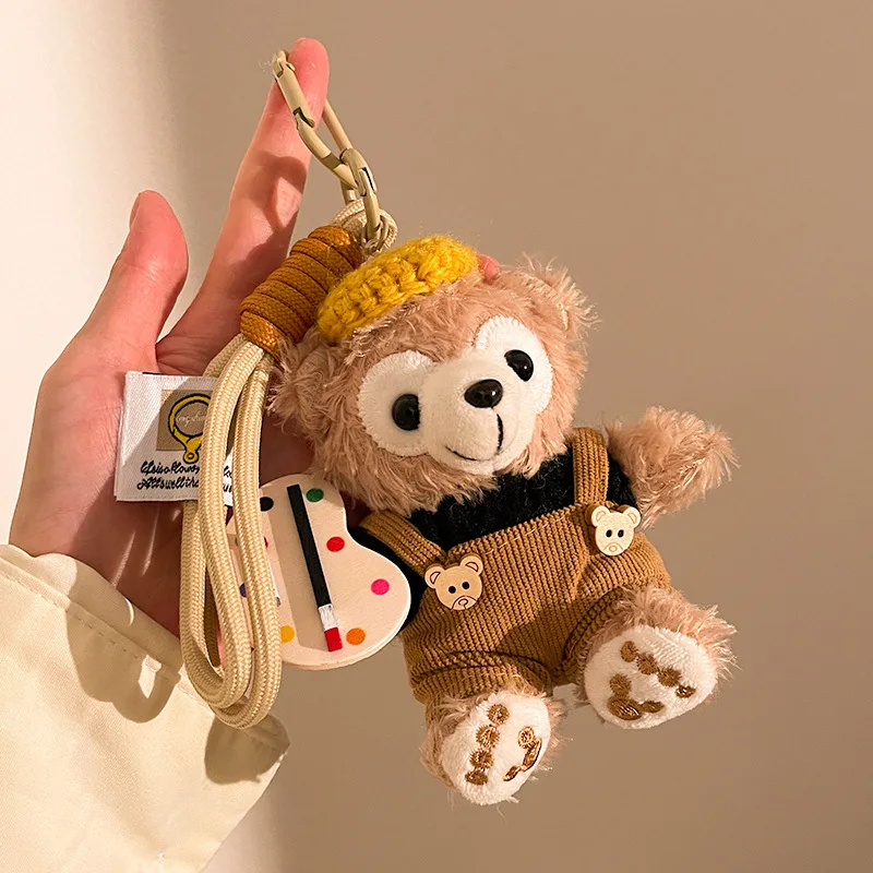 พวงกุญแจตุ๊กตาดิสนีย์เชลลี่เมย์ ตุ๊กตาขนนุ่ม ของตกแต่งกระเป๋าเป้สะพายหลัง ของประดับตกแต่งในรถยนต์ ของประดับตกแต่งเข็มขัด ของขวัญคริสต์มาสสำหรับเพื่อนสนิท