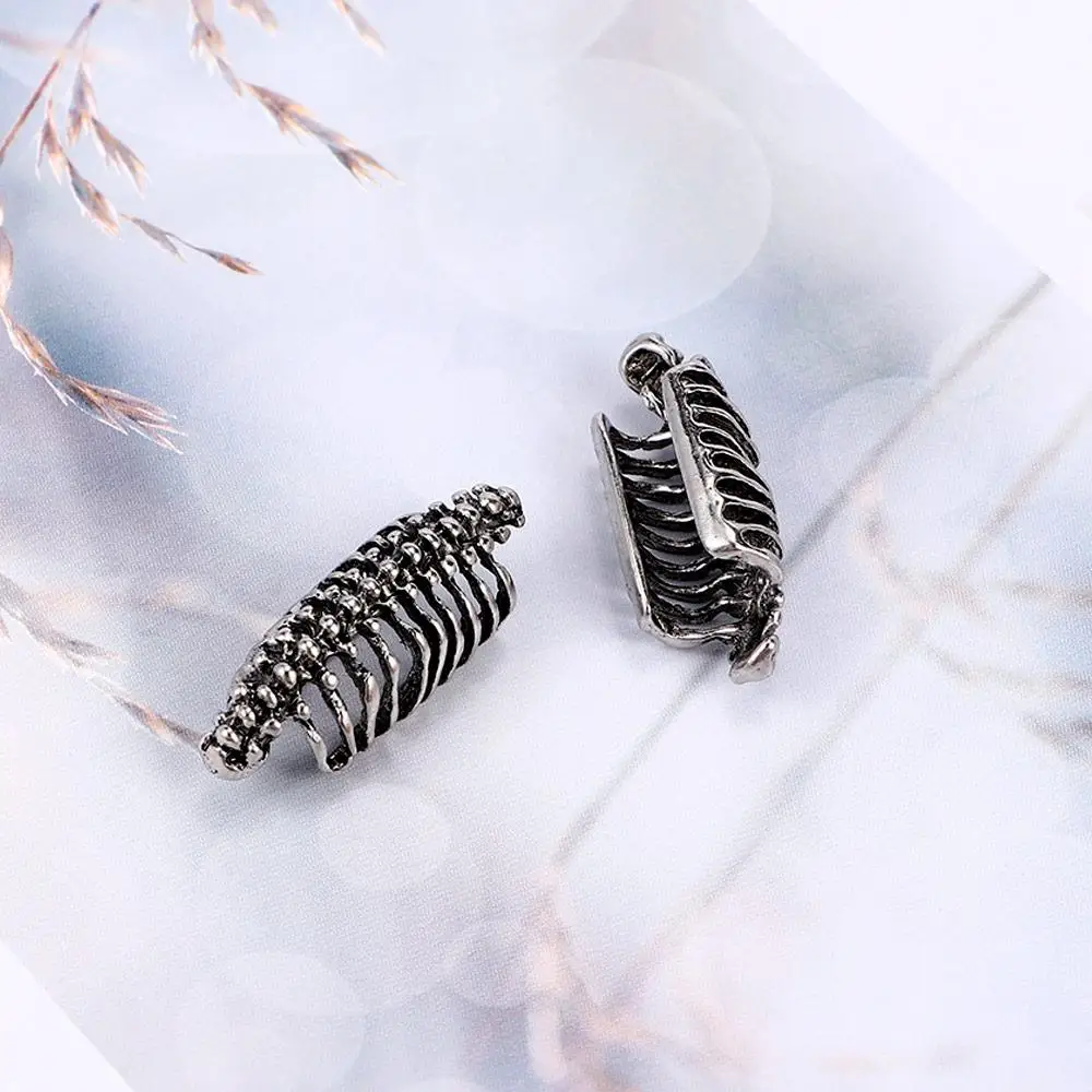 التفاف الرجعية العمود الفقري للجنسين الرجال كليب مسمار اليد مثقوب الأقراط الجمجمة الشرير القوطية