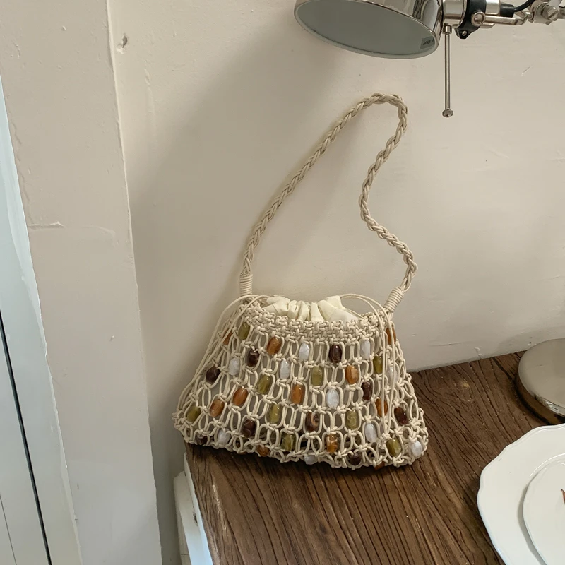 

Новая летняя сумка-макраме ручной работы в стиле бохо 2026 года для женщин: ажурная, разноцветная, с бисером, на плечо, для пляжного отдыха и повседневного использования