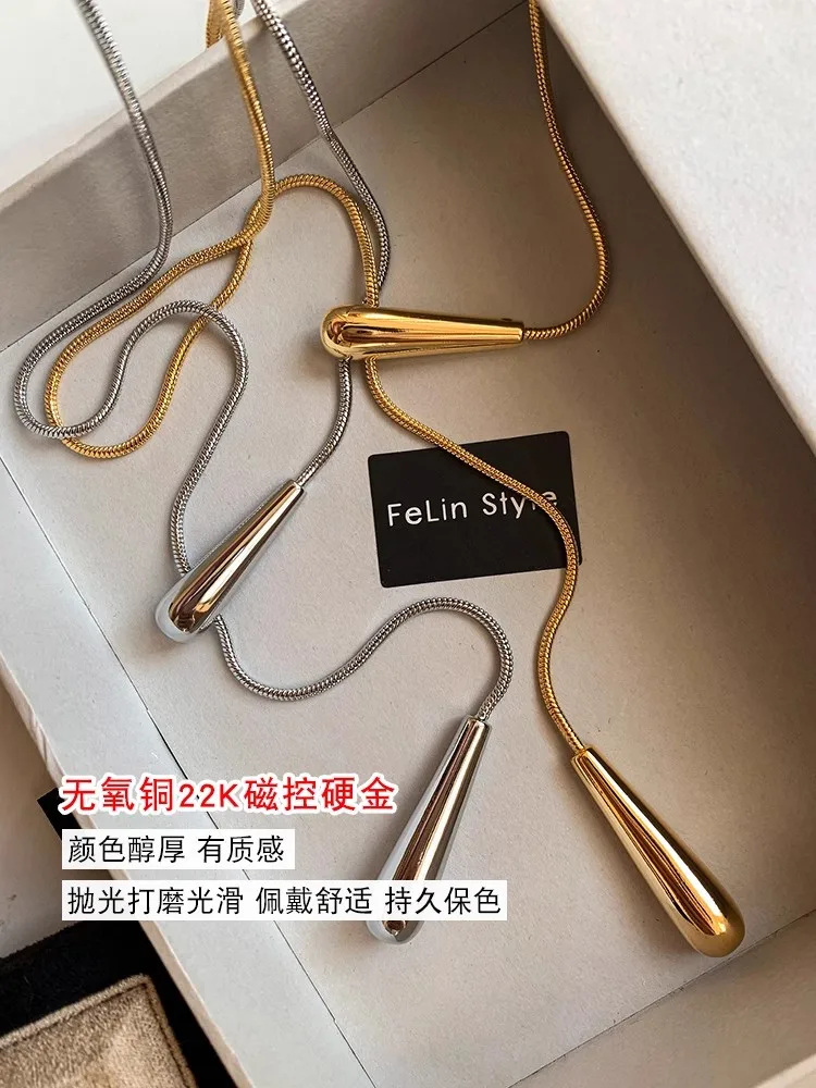 Y Europäische und amerikanische minimalistische lange goldene silberne ausziehbare Schlangenknochenkette mit Wassertropfen-Anhänger-Halskette für Frauen