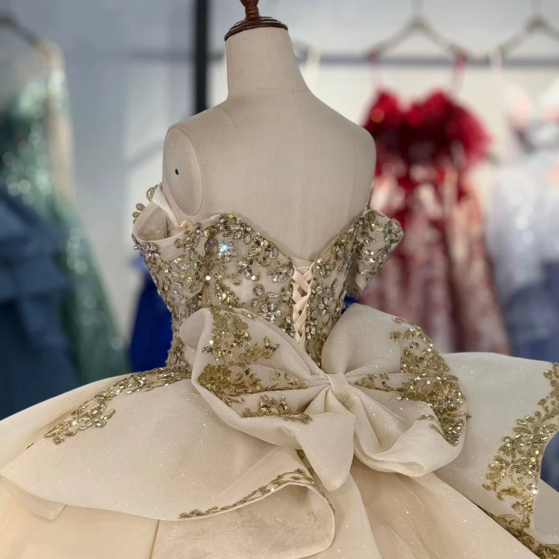 Champagne brillant Quinceanera robes hors de l'épaule or Applique dentelle perles cristal arc tulle fête anniversaire doux 16 robe