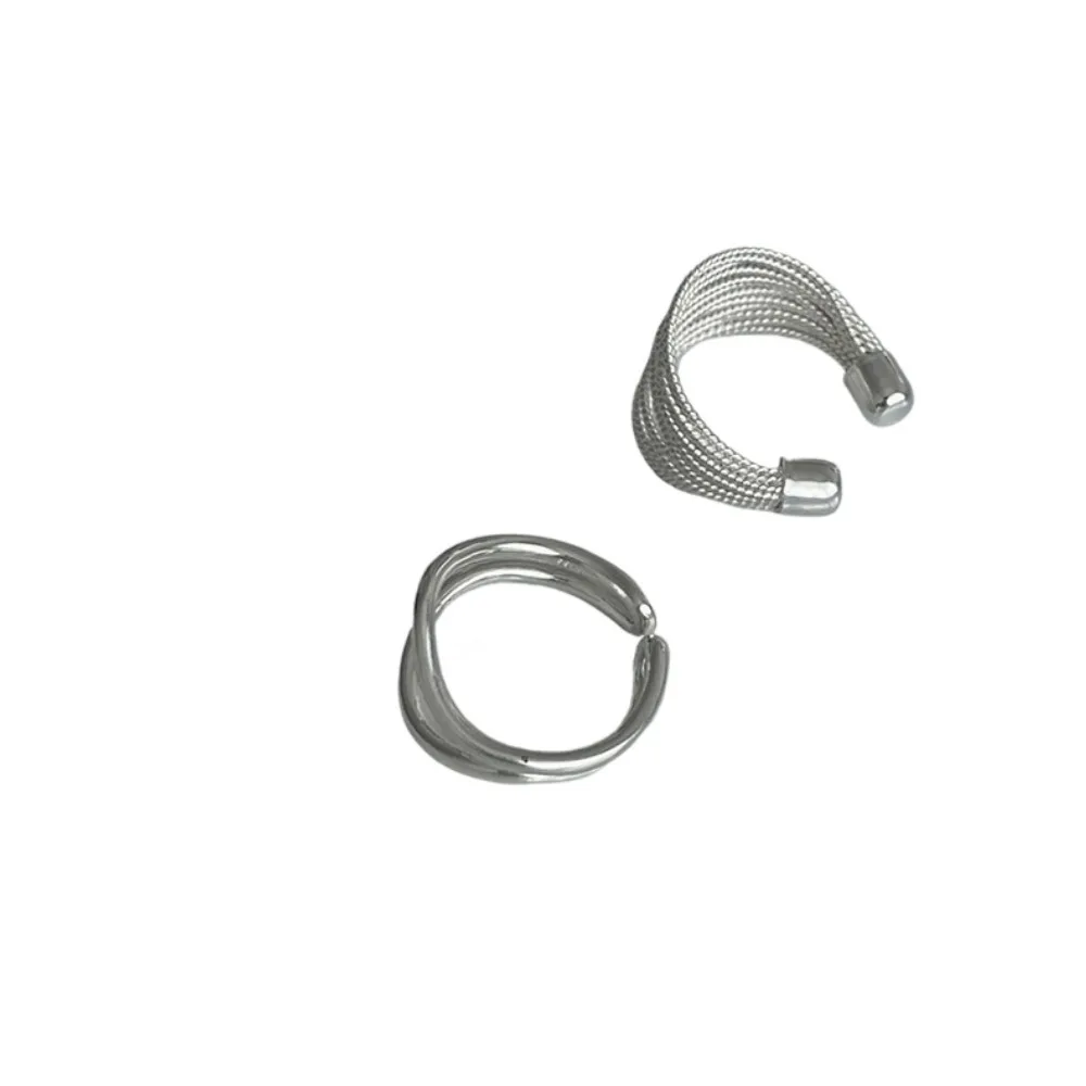 

Layered ring for women, with multiple layers of overlapping strands and exaggerated design