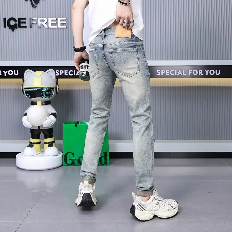 Ripped print jeans men's street fashion high-end fashion design leisure slim-fitting small straight stretch pants