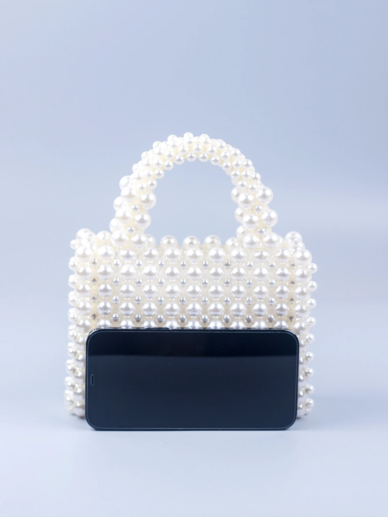 Small and high-end texture pearl hand-held woven pearl small square bag banquet bag, fashionable and versatile