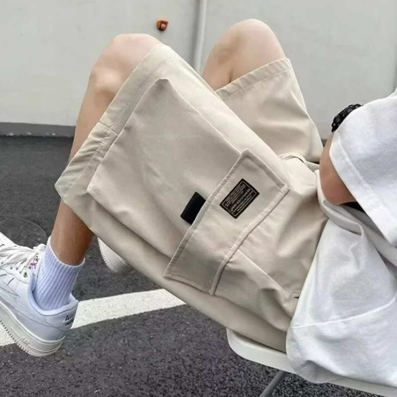 

Полумужские шорты-карго, длинные мешковатые однотонные шорты-бермуды с завязками, свободные короткие брюки для мужчин, широкие карманы, дизайнерская эластичная талия