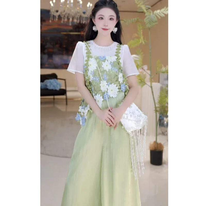 

Новый комплект из двух предметов Осенняя мода Цветочный круглый вырез с коротким рукавом в стиле пэчворк Искусственный топ из двух предметов + свободные широкие брюки Повседневная одежда