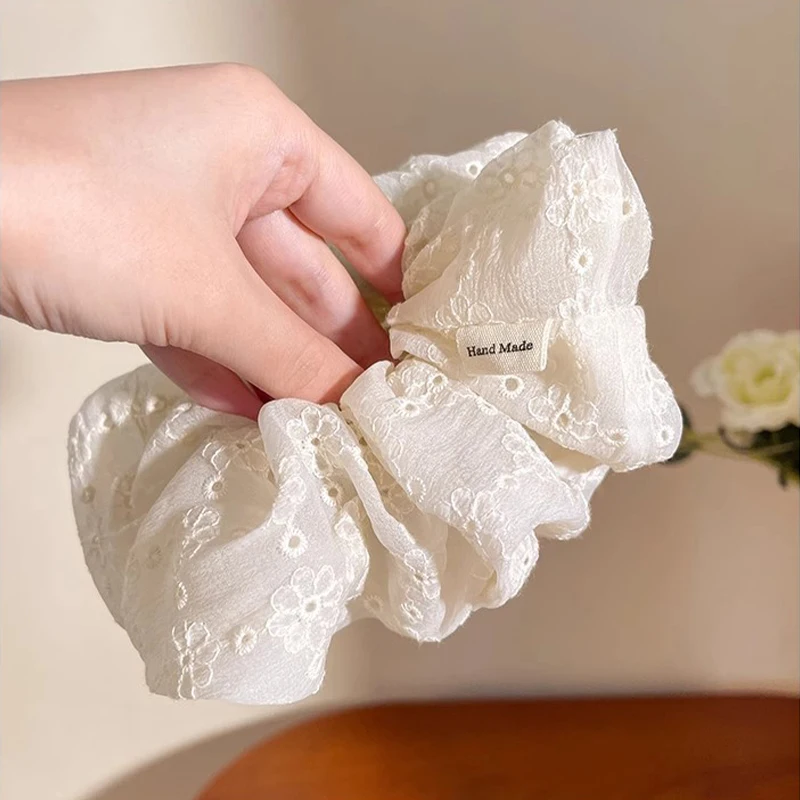 Oversized scrunchie with lace trim, perfect for women's ponytails, a super elegant double-layer hair accessory.