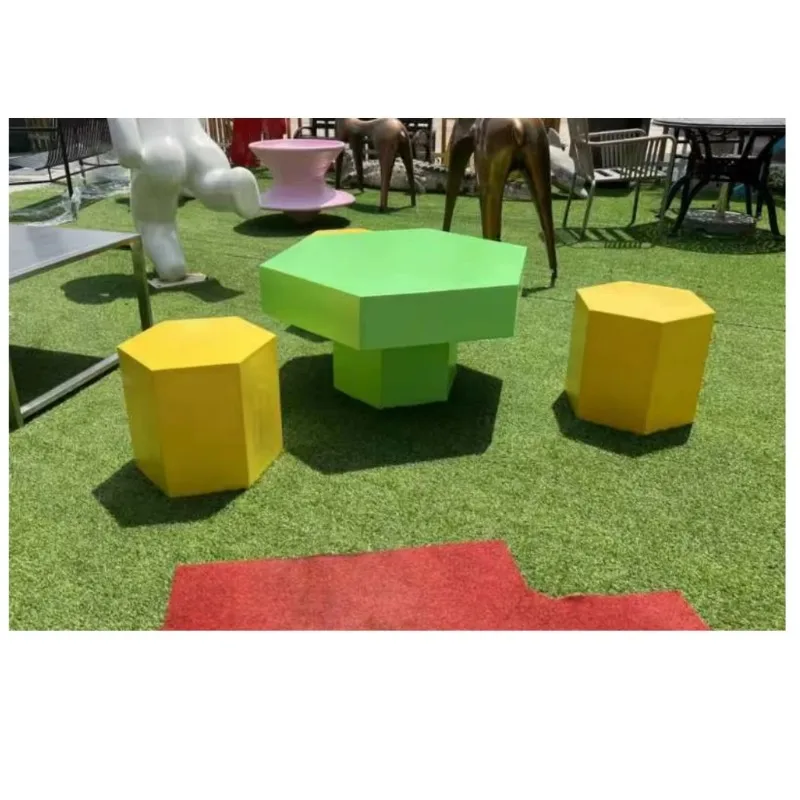 Decorative four-piece fiberglass stool and table set