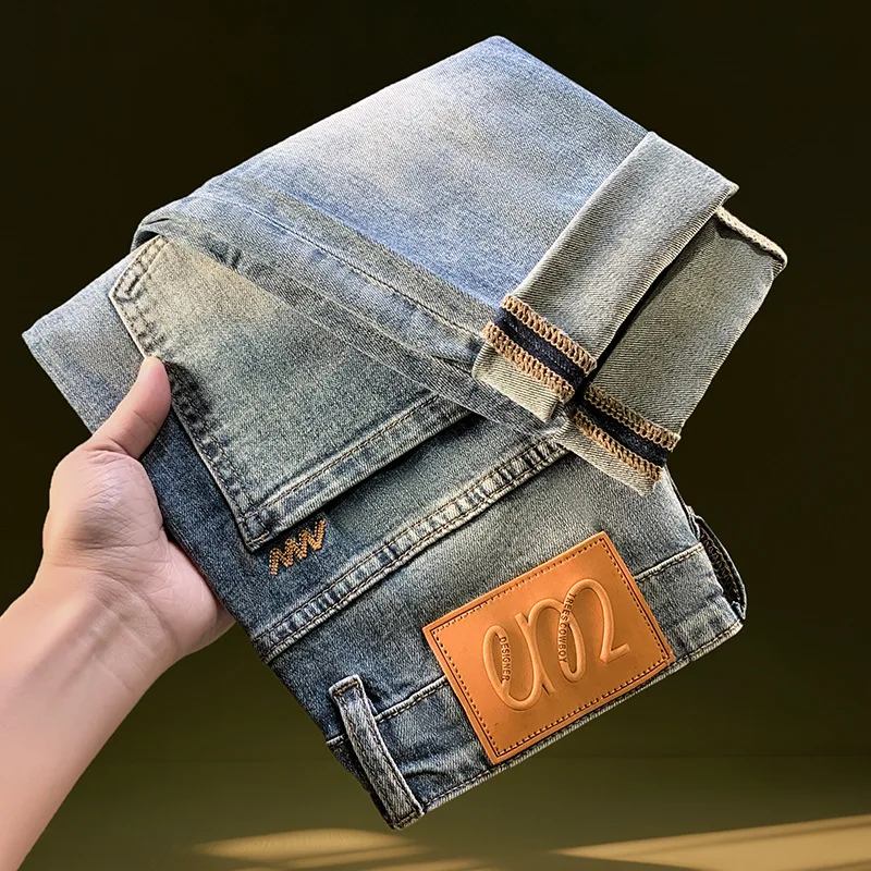 Nine point ripped denim jeans for men in the summer of 2025, thin and trendy brand retro washed, narrow leg elastic denim pants