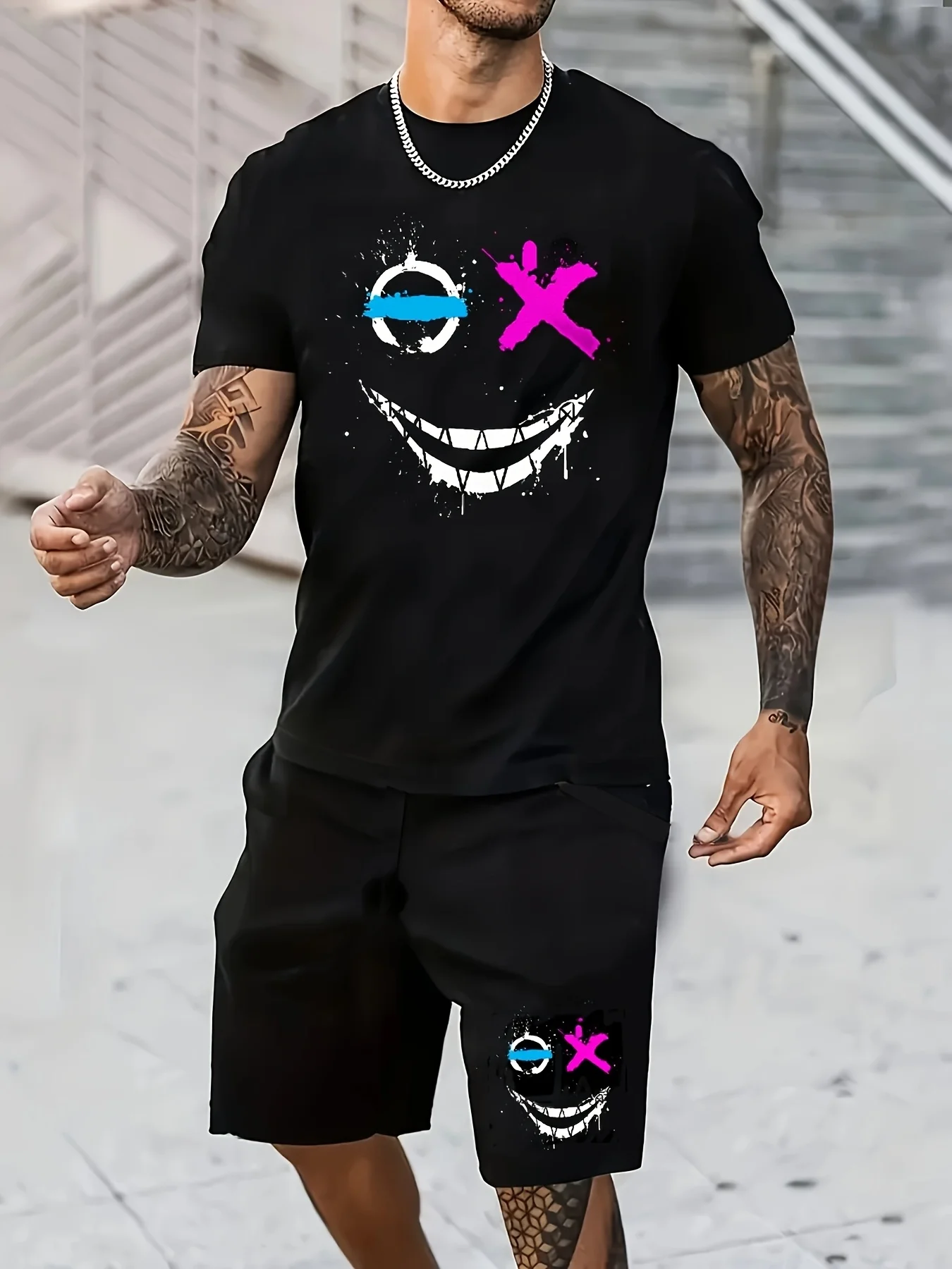 

A new summer 2025 casual, fashionable and sporty 3D smiling face graffiti printed breathable soft and comfortable men's suit