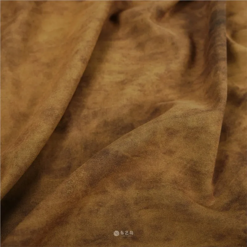 The designer fabric for shirt and skirt is a soft skin-friendly brown cotton-linen tie-dye blend