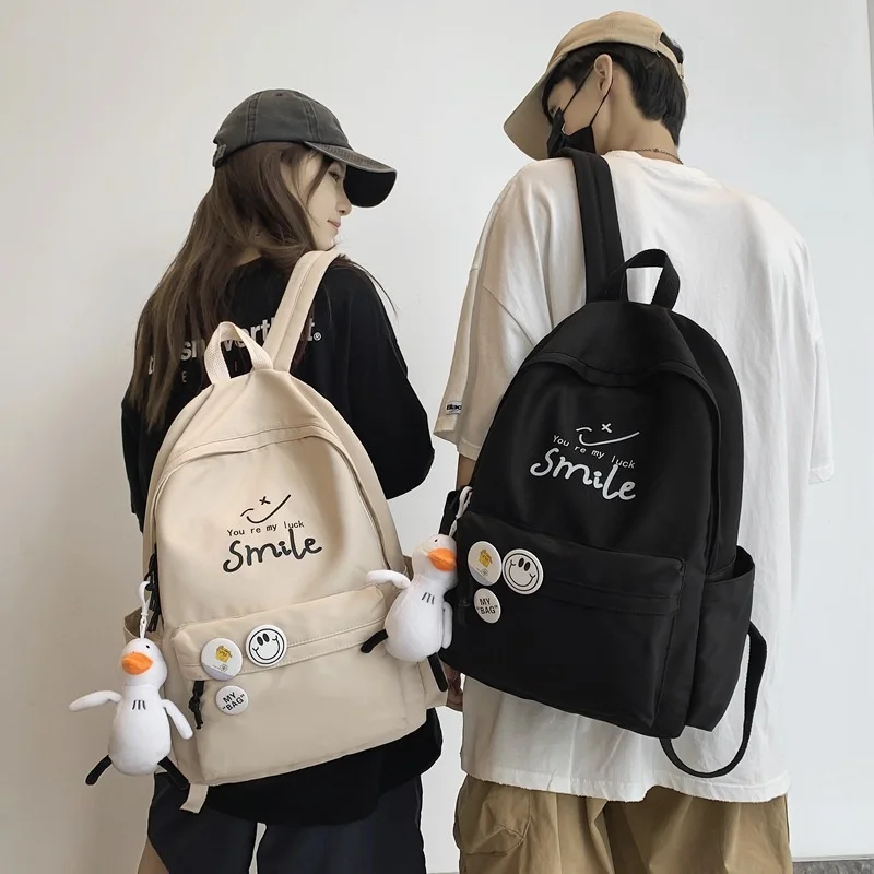 Bolsos de escuela secundaria para niñas y niños, bolsa de libro de sonrisa de color sólido simple, mochila negra para estudiantes universitarios para mujeres