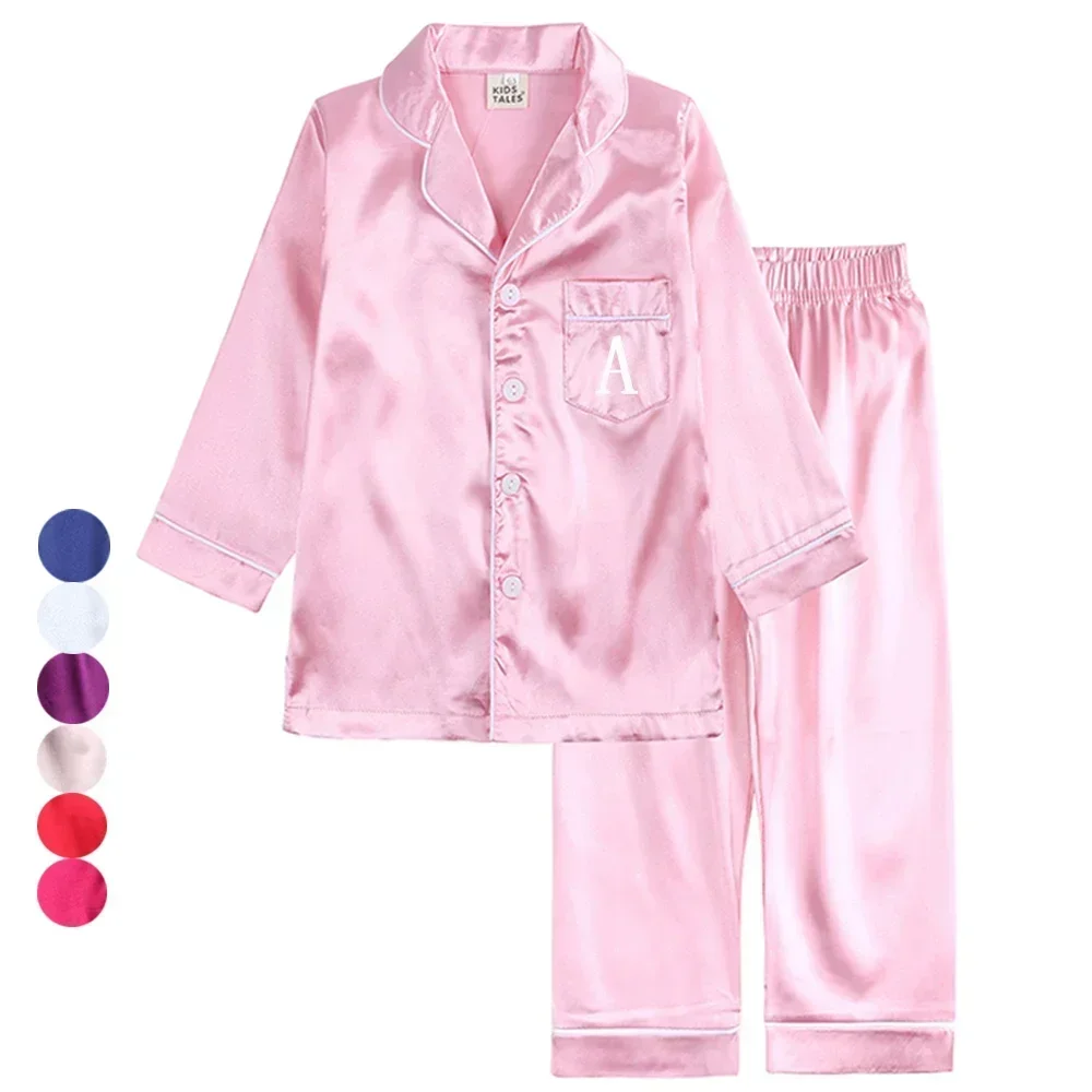 Pijamas de satén de seda personalizados para niños y niñas, conjunto de salón de color liso con logotipo impreso, para fiesta de Navidad, 2024