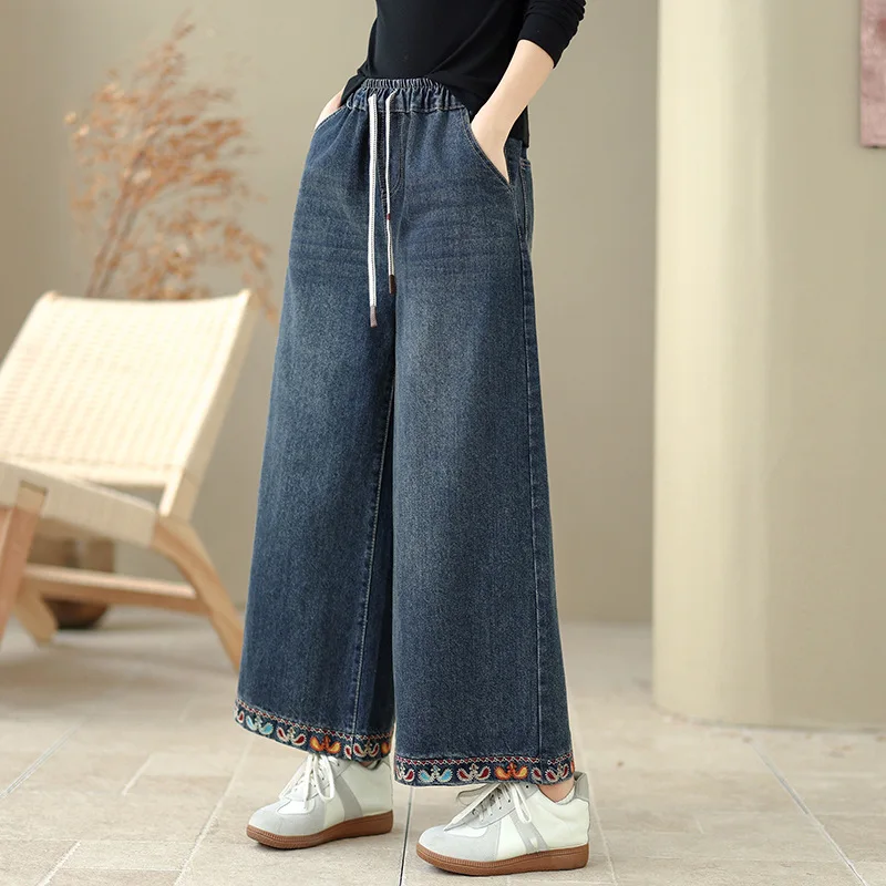 Hoge kwaliteit dames denim broek herfst en winter 2026 etnische stijl bloem geborduurde denim wijde pijpen broek gezellige broek