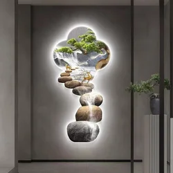 The entrance to the living room is decorated with wall lamps and paintings, and the pine trees emit a luxurious atmosphere.