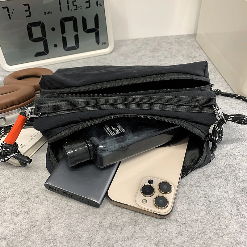 Neue mehrschichtige, einschultrige, lässige und vielseitige Umhängetasche aus Nylon für Damen. Eine Sport-Handytasche, die eine Wasserflasche hält