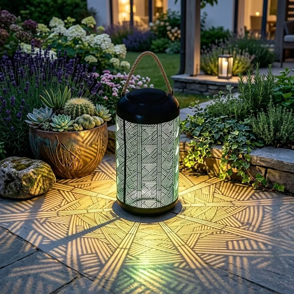 Self-Powered Solar Lantern with Rope Handle for Placement Geometric Cutouts Generate Visual Interest in Garden Settings