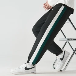 Plus-size męskie spodnie Baggy edge striped sznurkiem spodnie do joggingu nowe męskie spodnie dresowe rajstopy Gym student pants